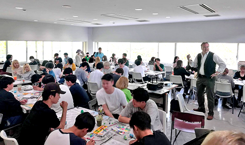 Teachers and students gather for a workshop on Easter crafts